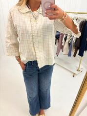 Light Blue Plaid Ruffle Top showing checkered