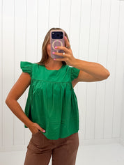 Green Ruffle Sleeve Babydoll Top showing ruffle sleeves