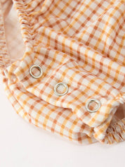 Orange Plaid Floral Bubble Romper showing gathered detailing