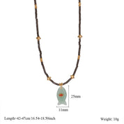 Green Fish Necklace With Gem — color: green and fish pendant with gemstone