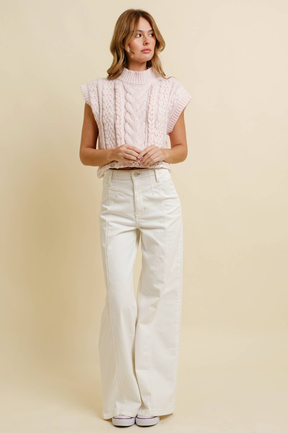 Light Pink Cable Knit Sweater Vest showing sleeveless with drop shoulders