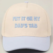 Light Blue Put It On My Dad's Tab Hat — “put it on my dad’s tab” lettering across the front and cream base with light