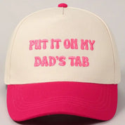 Hot Pink Put It On My Dad's Tab Hat — “put it on my dad’s tab” lettering across the front and cream base with hot pink bill