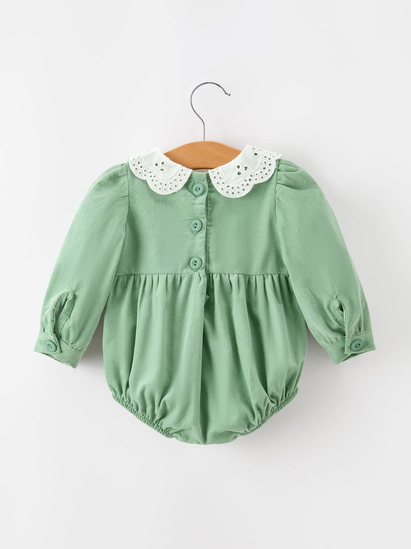 Green Smocked Floral Romper showing smocked chest panel