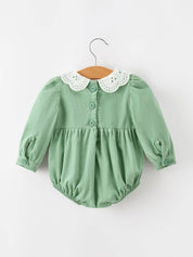 Green Smocked Floral Romper showing smocked chest panel
