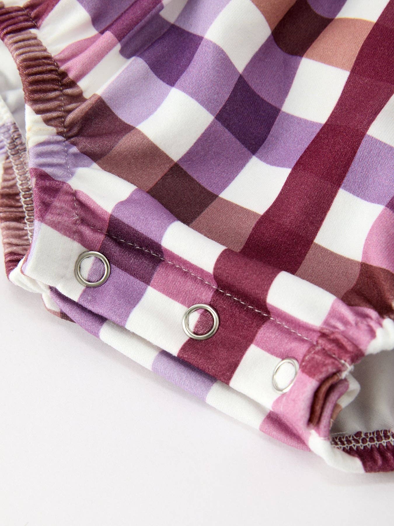 Fall Plaid Bow Ruffle Girls Bubble Romper showing oversized bow accent at the back