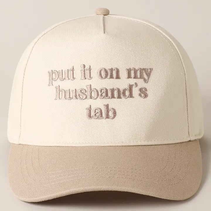 Beige Put It On My Husband's Tab Hat — “put it on my husband’s tab” across the front and embroidered detailing