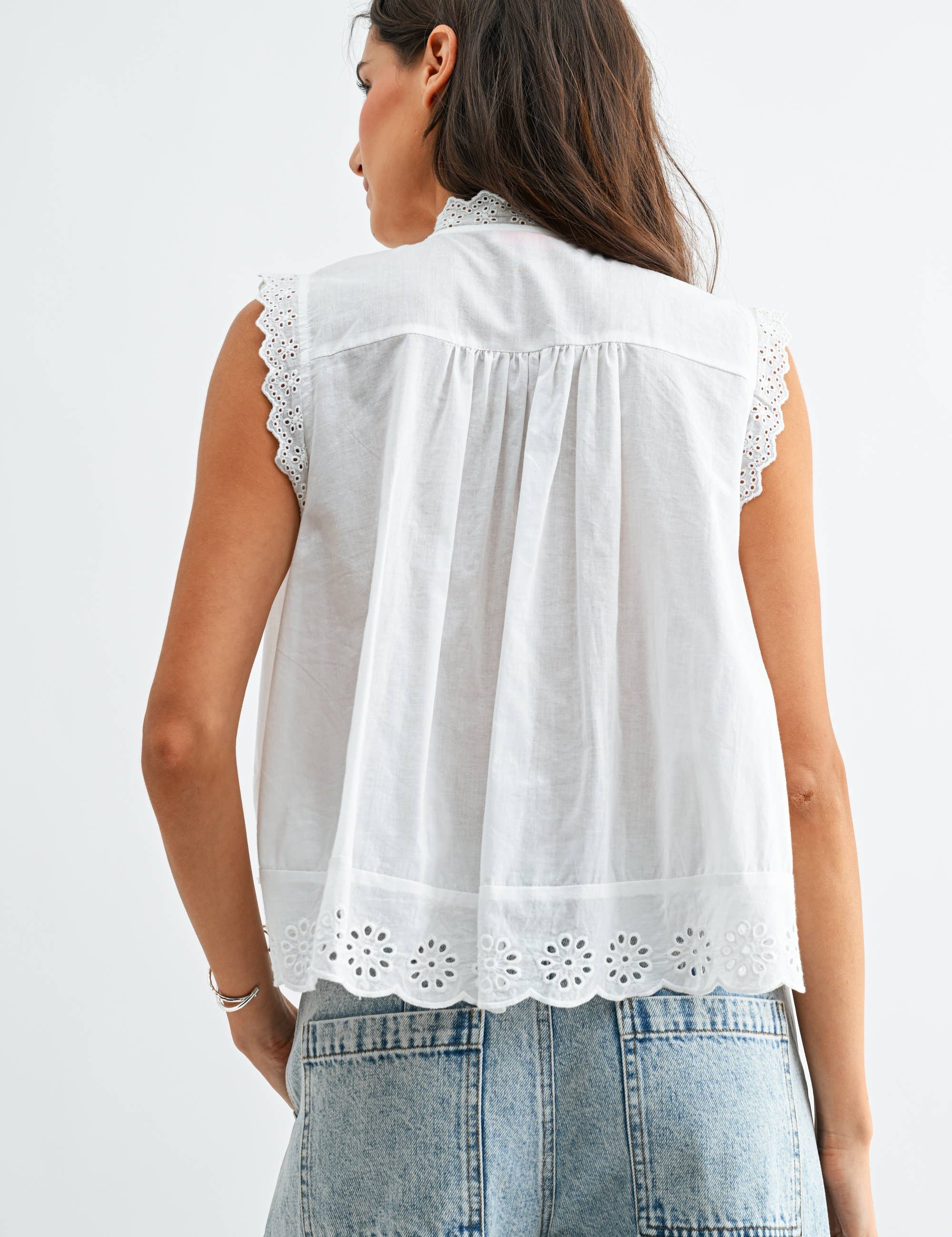 White Sleeveless Cotton Blouse showing sleeveless blouse