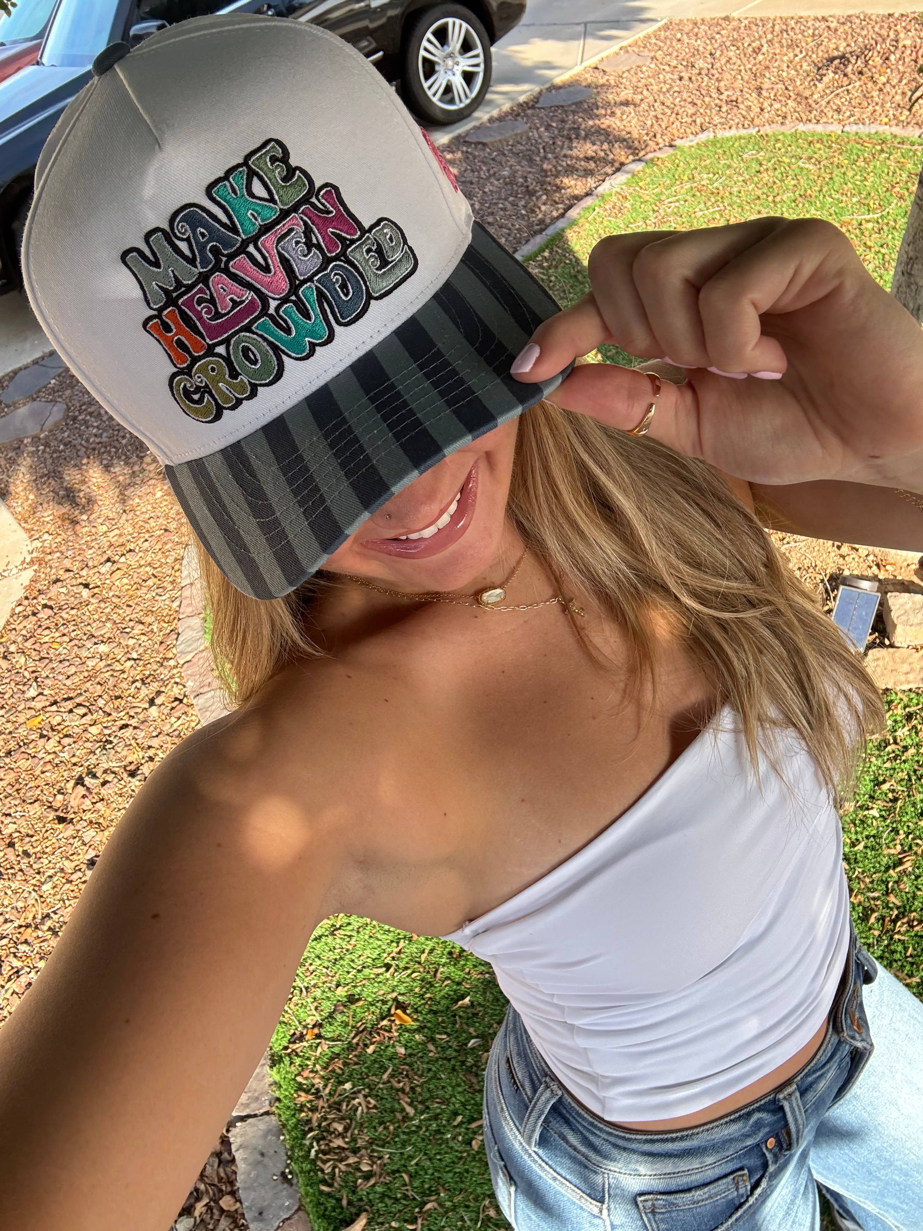 Make heaven crowded trucker hat showing “make heaven crowded” embroidered trucker hat