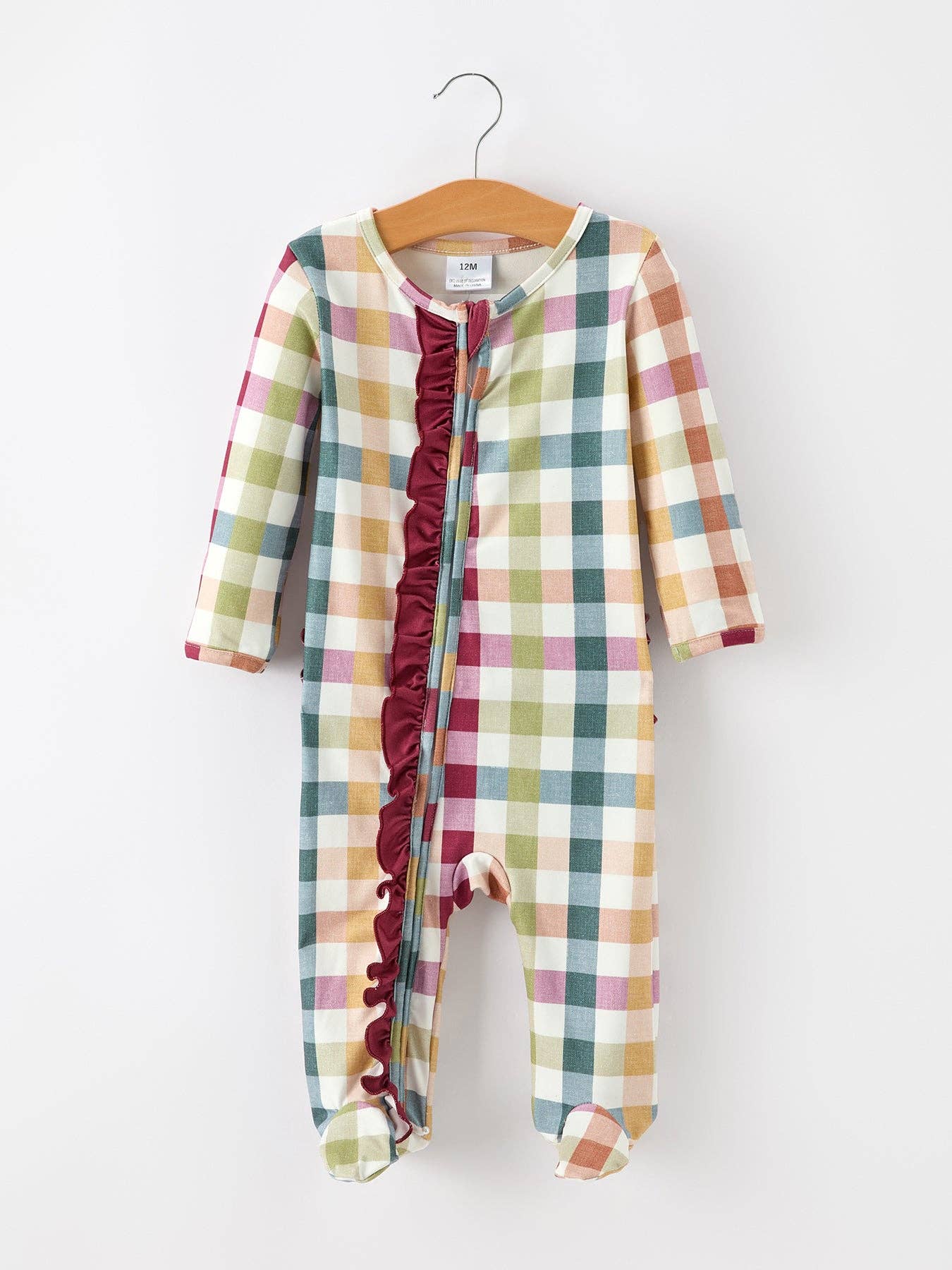 Plaid Ruffle Footie Pajamas — ruffle detail along the front and long sleeves