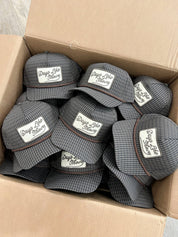 Days Like These Plaid Patch Hat Fall Hat — grey and navy plaid trucker hat and brown rope detail across the front
