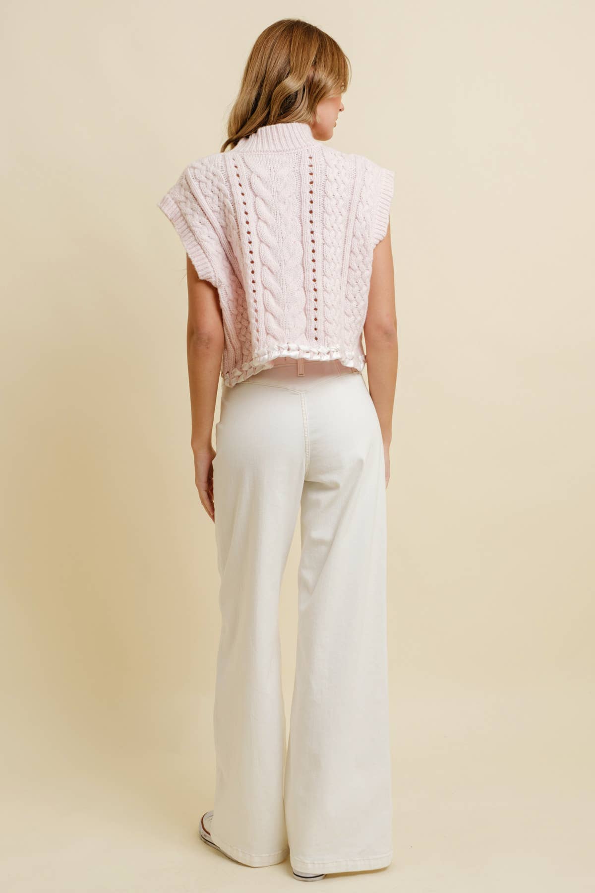 Light Pink Cable Knit Sweater Vest showing cable knit