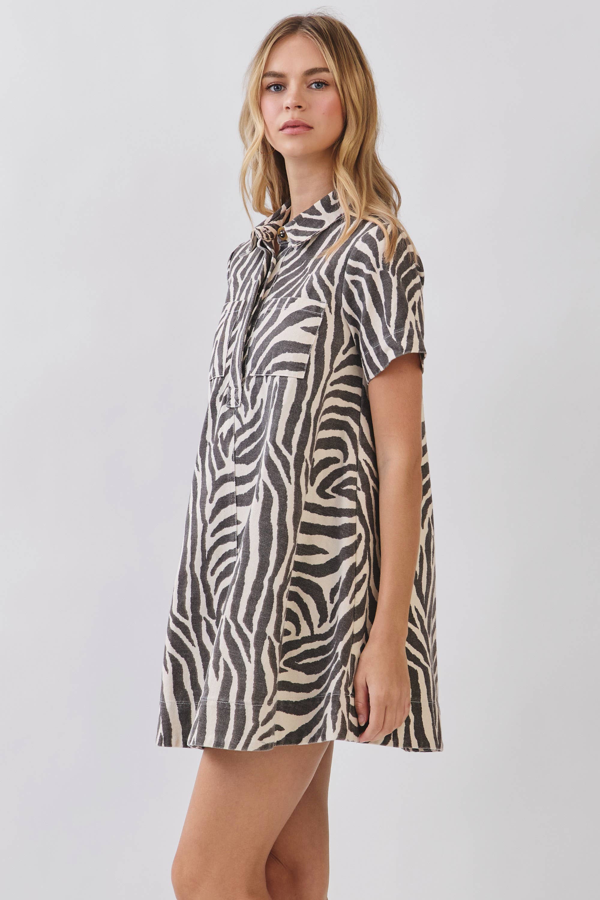 Zebra Print Button Collared Mini Dress showing front flap pockets
