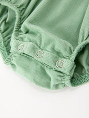 Green Smocked Floral Romper showing white eyelet peter pan collar