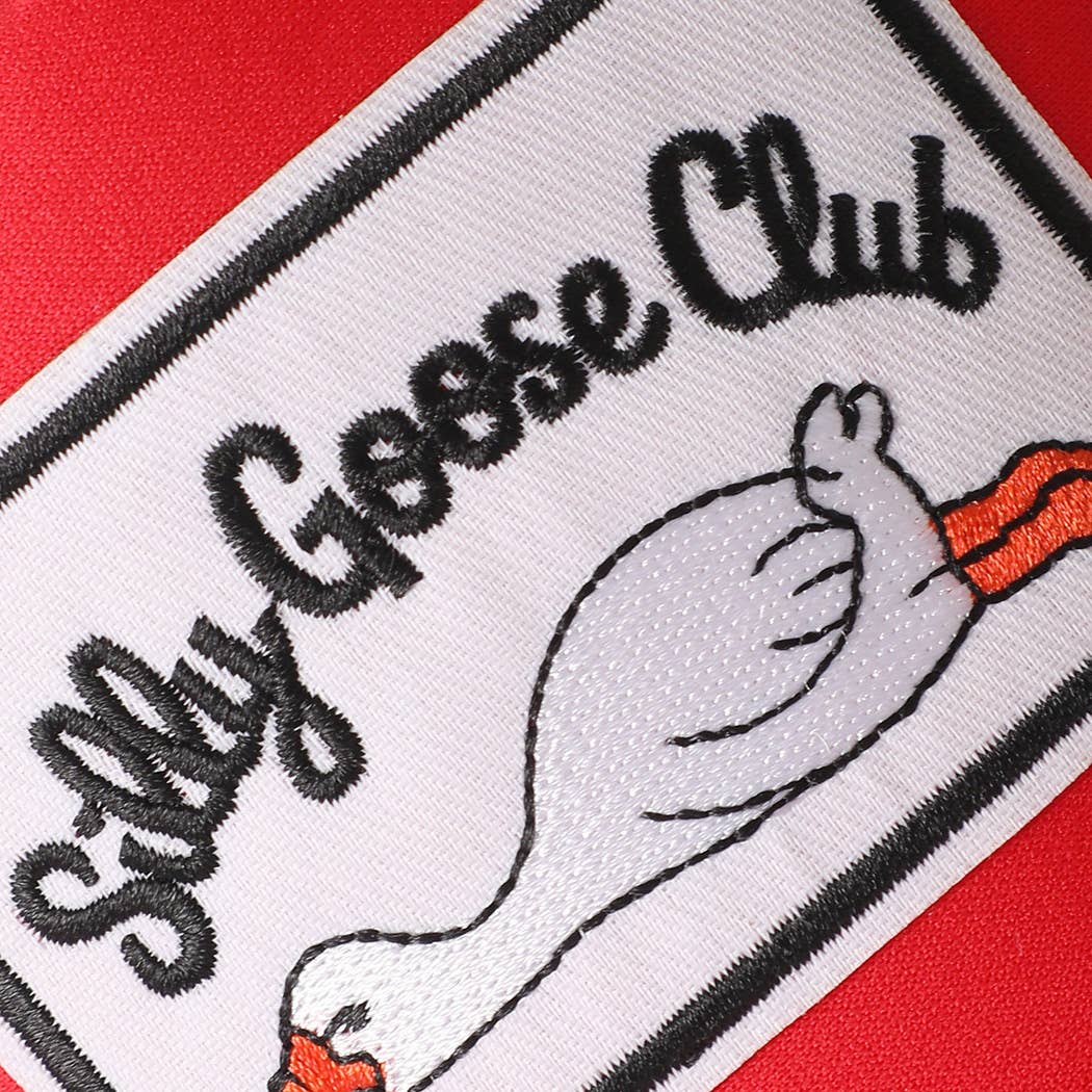 Red Silly Goose Club Hat showing "silly goose club" embroidered patch design