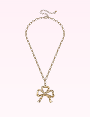 Ninety Nine Boutique super-pale pink accessory product photo: Greyson Bow Pendant Necklace in Worn Gold (September 30, 2026)