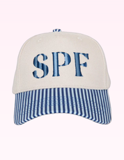 Ninety Nine Boutique super-pale pink accessory product photo: Navy SPF Trucker Hat (September 30, 2026)