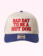Ninety Nine Boutique super-pale pink accessory product photo: Blue Bad Day To Be A Hot Dog Trucker Hat (September 30, 2026)