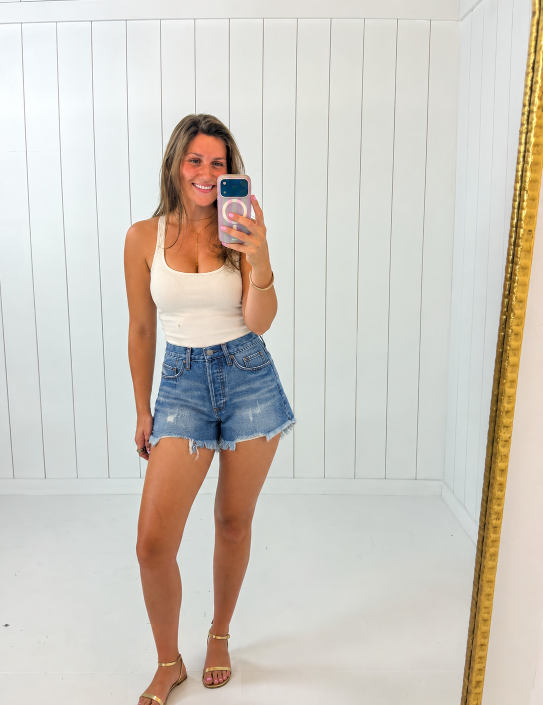 AI-assisted styled photo of Backyard Denim Shorts on boutique owner, soft original-room lighting approved September 21 2026