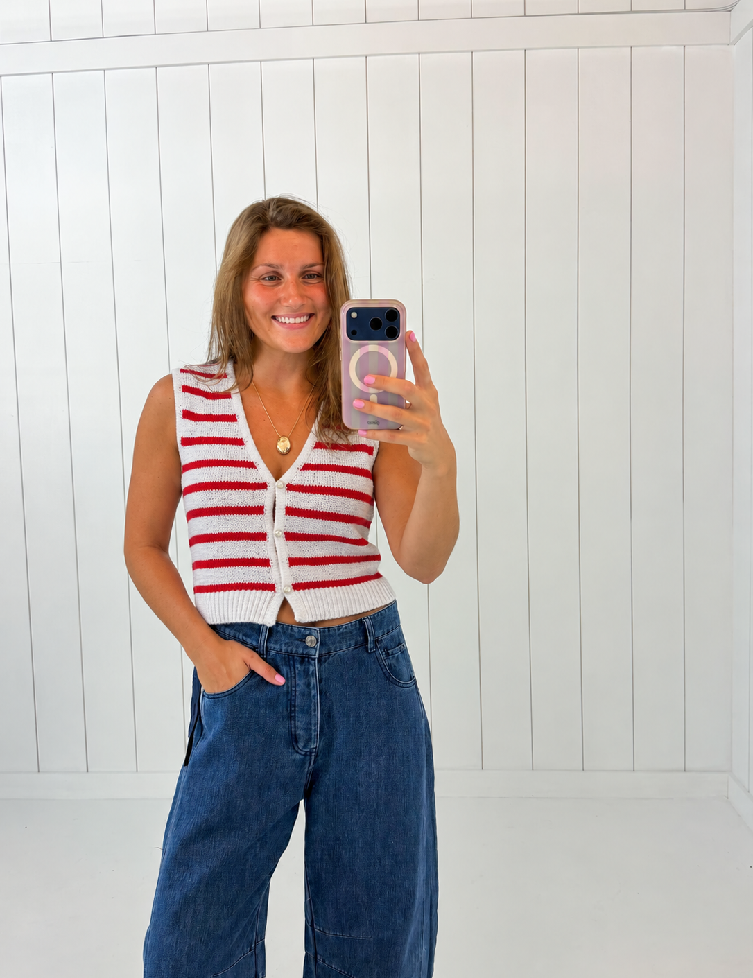 AI-assisted styled photo of Red & White Striped Button Up Vest Top on boutique owner, soft original-room lighting approved September 21 2026