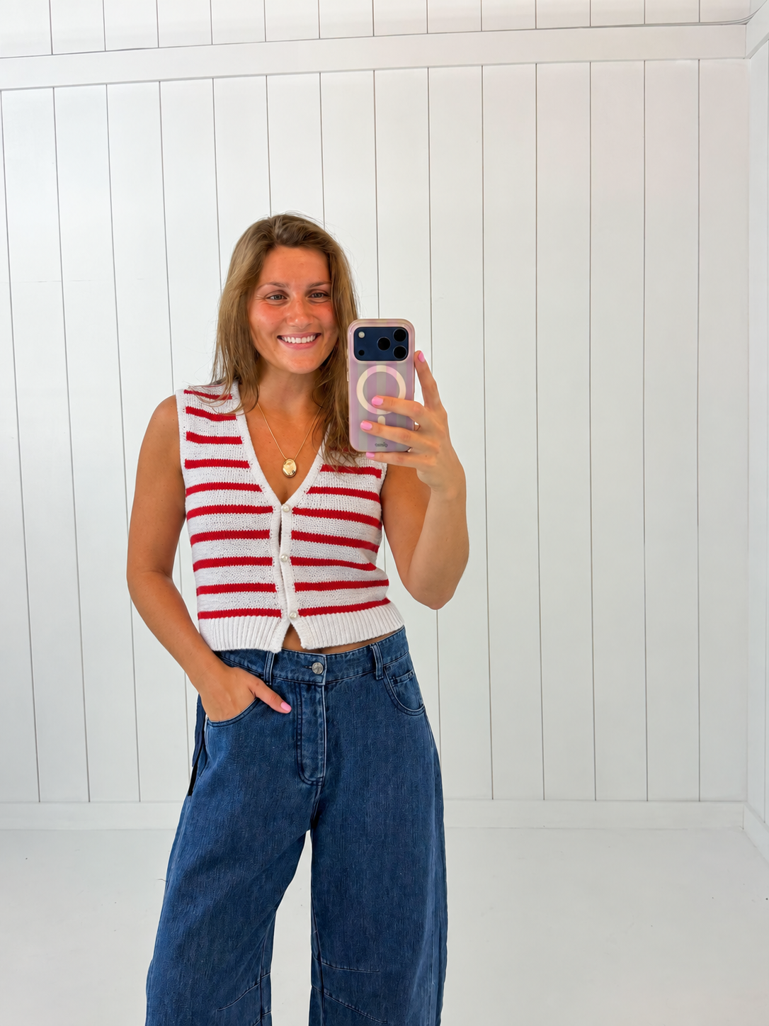 AI-assisted styled photo of Red & White Striped Button Up Vest Top on boutique owner, soft original-room lighting approved September 21 2026