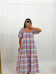 AI-assisted styled photo of Multi Color Plaid Midi Dress on boutique owner, soft original-room lighting approved September 21 2026