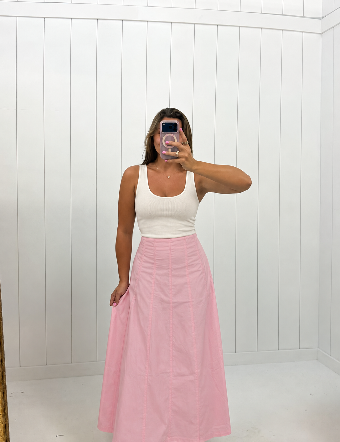 AI-assisted styled photo of Pink Contrast Detail Maxi Skirt on boutique owner, soft original-room lighting approved September 21 2026