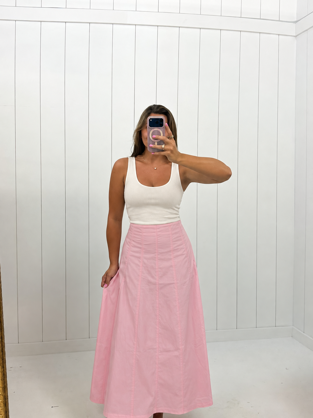 AI-assisted styled photo of Pink Contrast Detail Maxi Skirt on boutique owner, soft original-room lighting approved September 21 2026