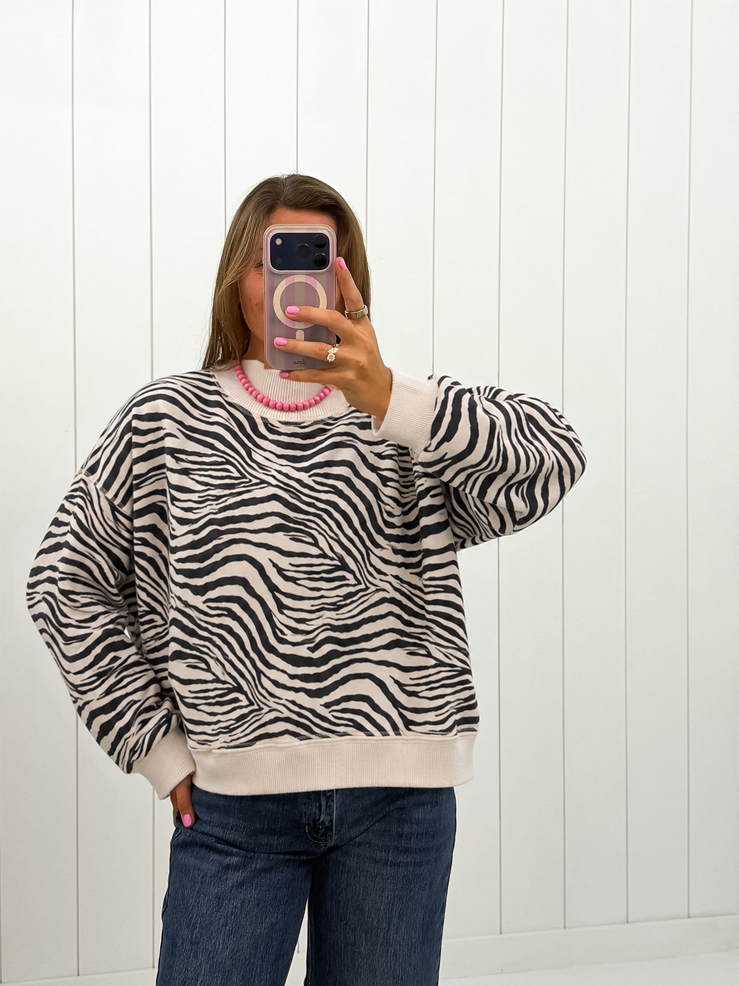 AI-assisted styled photo of Zebra Mockneck Sweatshirt on boutique owner, soft original-room lighting approved September 21 2026