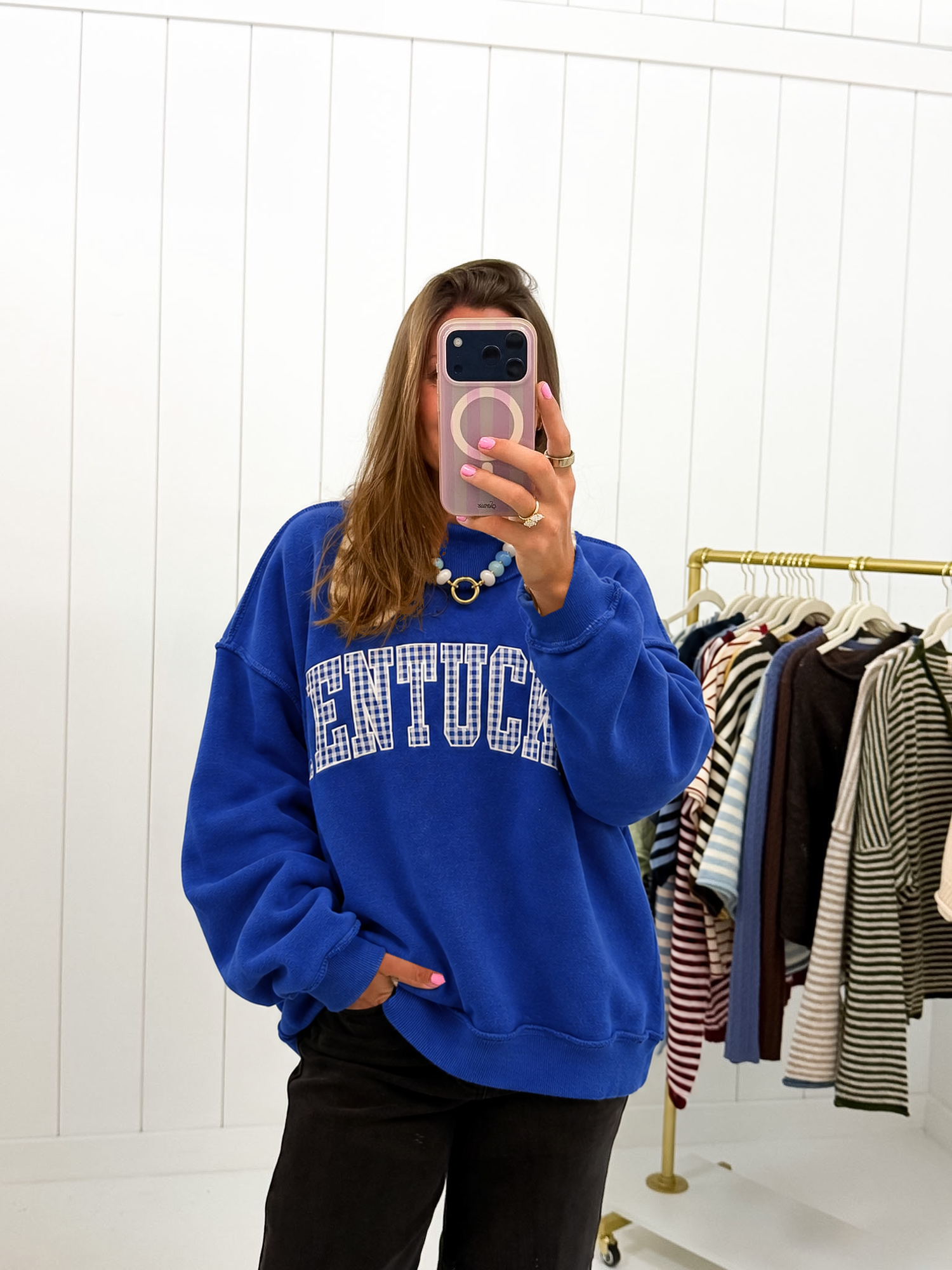 AI-assisted styled photo of Blue Gingham Kentucky Mockneck on boutique owner, soft original-room lighting approved September 21 2026