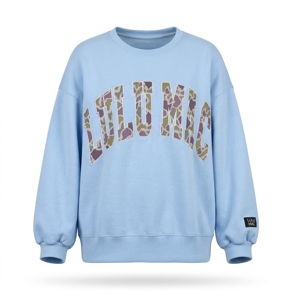 AI-assisted FASHN try-on of Light Blue Camo Sweatshirt Lulu Mac on boutique owner.