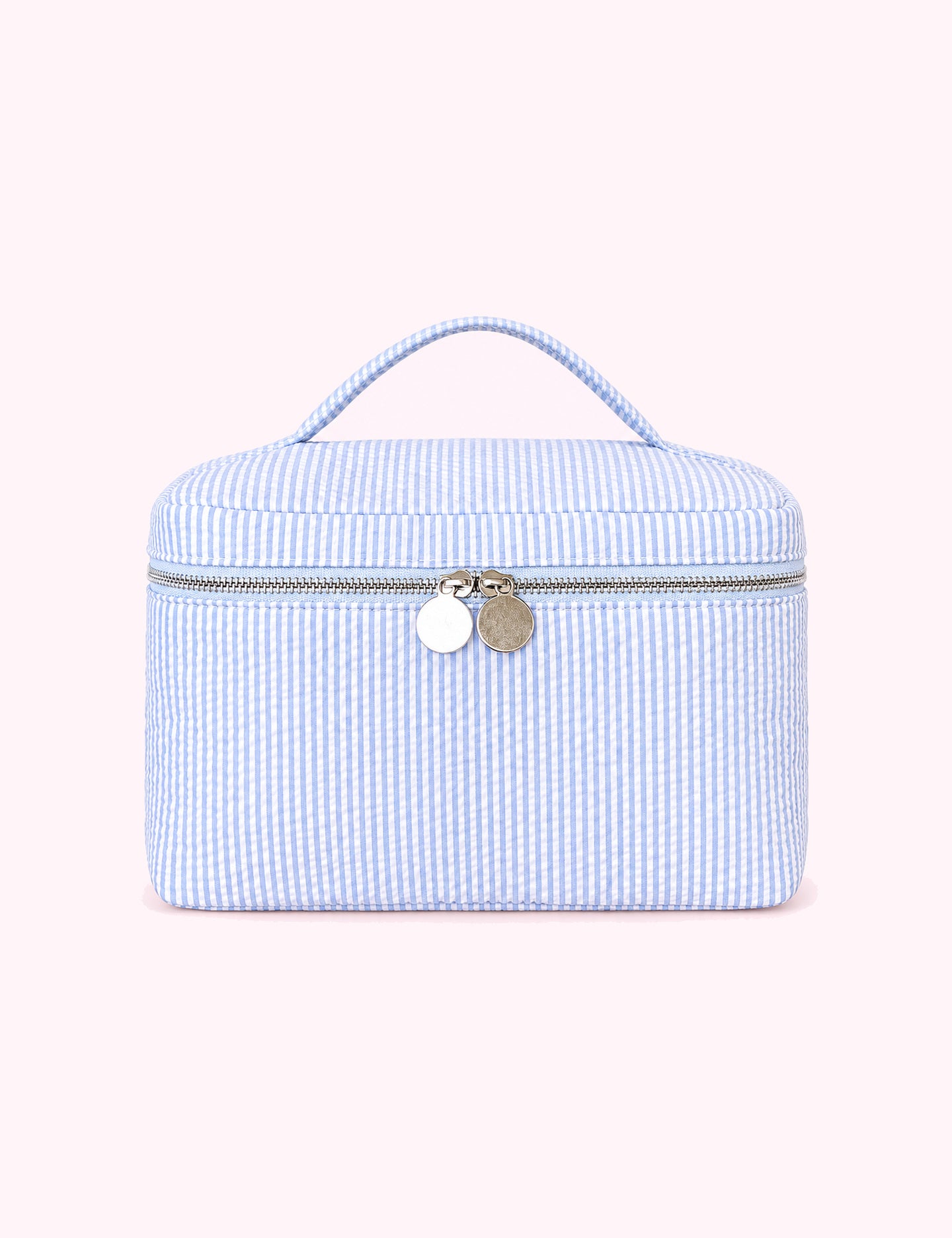Ninety Nine Boutique super-pale pink accessory product photo: Blue Seersucker Cosmetic Bag (October 2, 2026)
