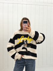 AI-assisted virtual try-on of Black Lucky & Mallard Mockneck on boutique owner. Approved October 4, 2026; no-feet crop.