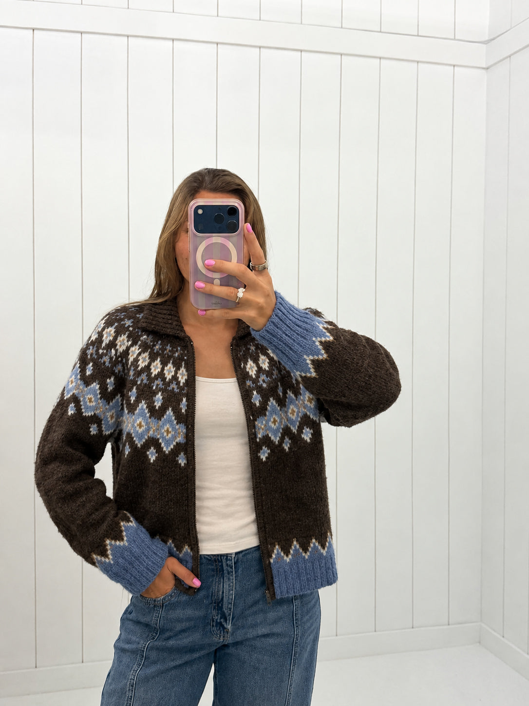 AI-assisted virtual try-on of Brown Zip-Up Cardigan Sweater on boutique owner. Approved October 4, 2026; no-feet crop.