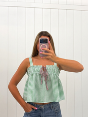 AI-assisted FASHN try-on of Green Seersucker Gingham Print Tank Top on boutique owner.