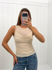 AI-assisted FASHN try-on of Cream Mesh Top on boutique owner.