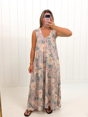 AI-assisted FASHN try-on of Pink Floral Sleeveless Dress on boutique owner; approved September 24, 2026 redo using IMG_4945.jpeg.