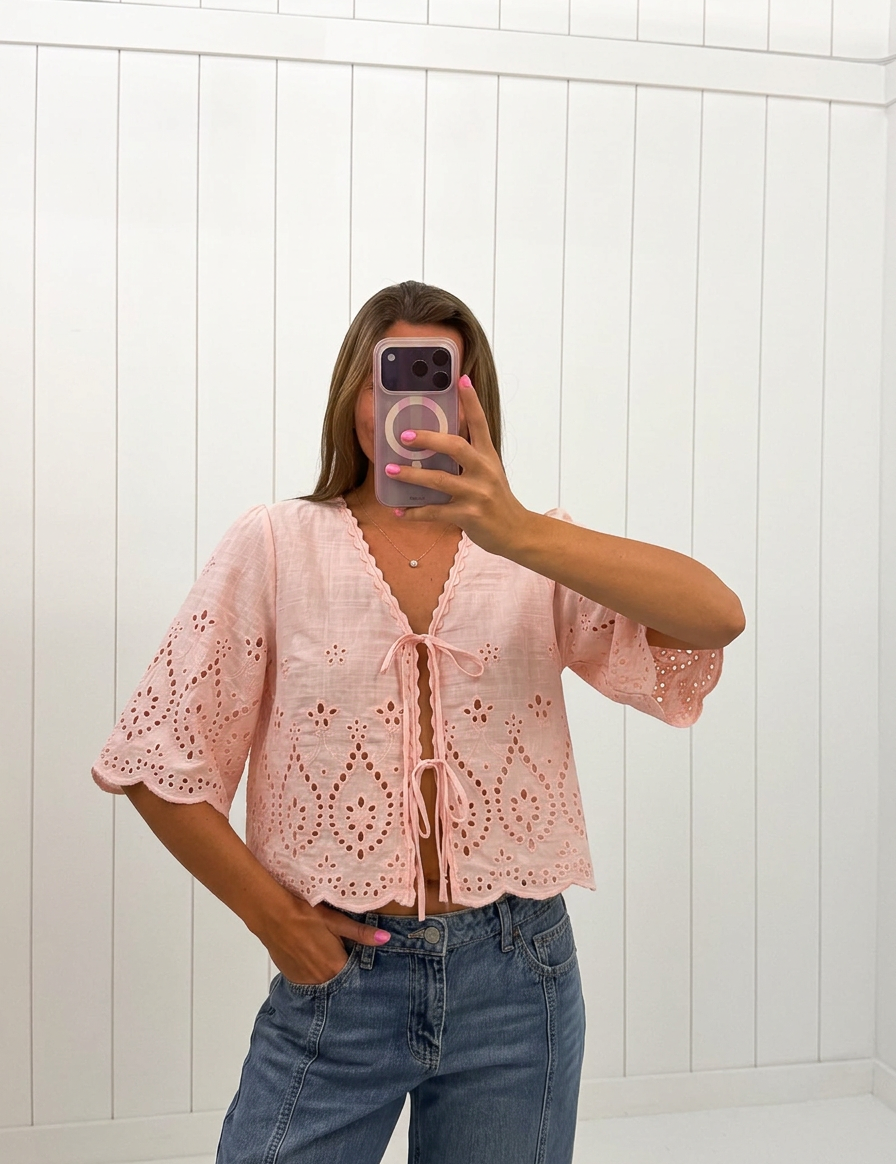 AI-assisted FASHN try-on of Woven Embroidered V-Neck Top on boutique owner.