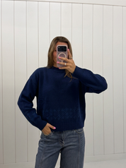 AI-assisted FASHN try-on of Navy Scalloped Mock Neck Sweater on boutique owner; approved September 24, 2026 redo using IMG_5191.jpeg.