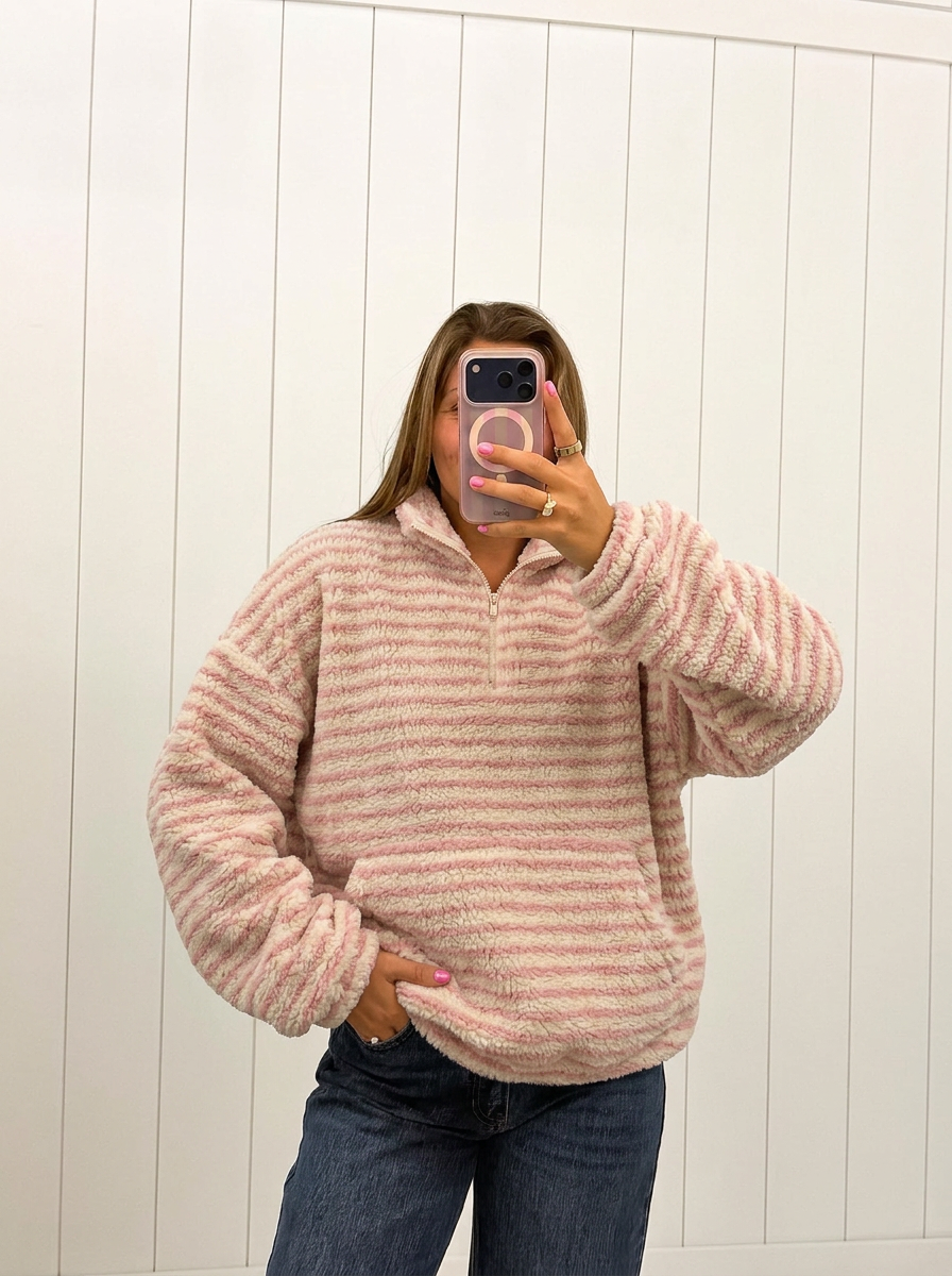 AI-assisted FASHN try-on of Pink Stripe Sherpa Pullover on boutique owner.