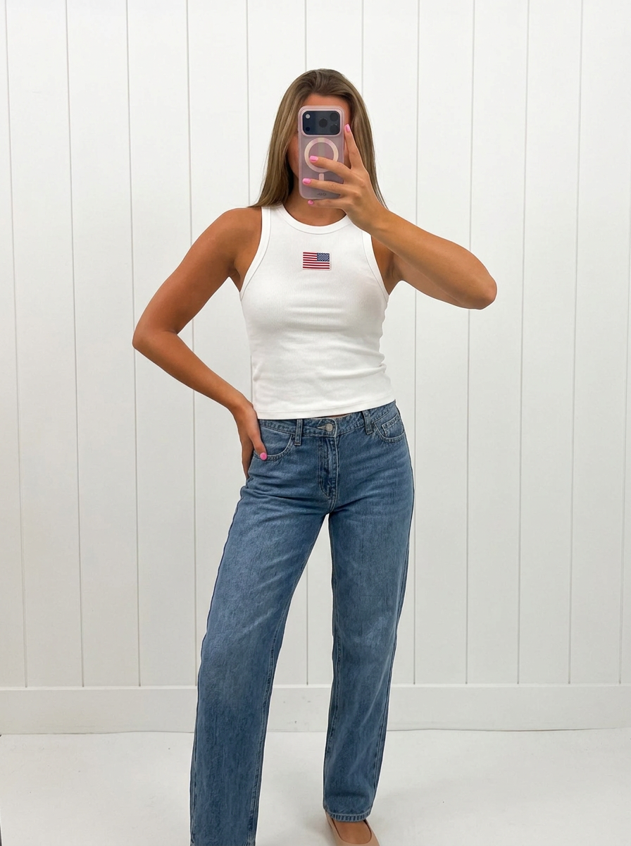 AI-assisted FASHN try-on of White USA Ribbed Tank Top on boutique owner.