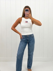 AI-assisted FASHN try-on of White USA Ribbed Tank Top on boutique owner.