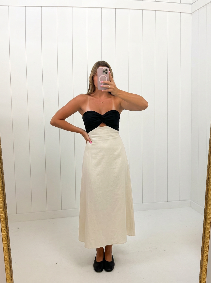 AI-assisted FASHN try-on of Linen Colorblock Front Twist Midi Dress on boutique owner.