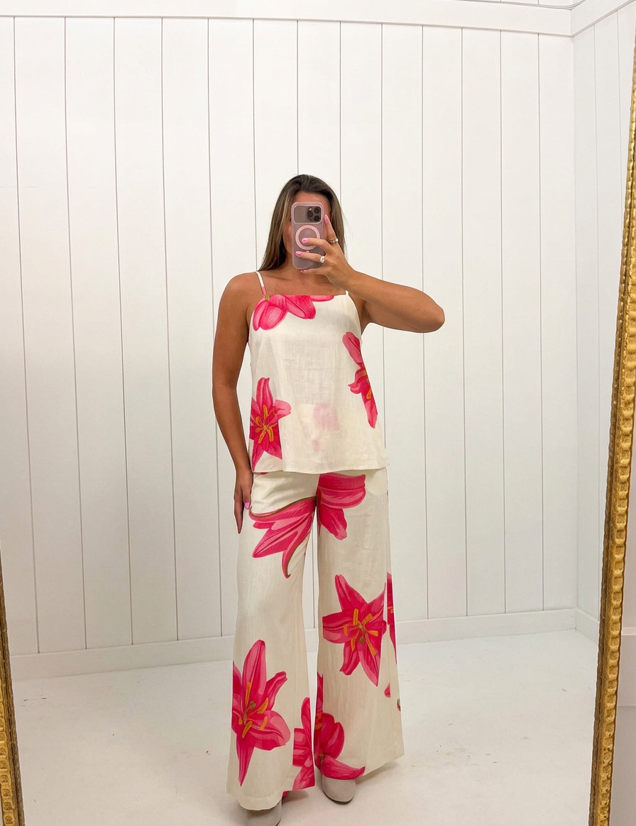 AI-assisted FASHN try-on of Cream Floral Print Cami Pants Set on boutique owner.