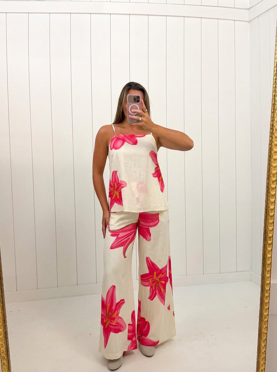 AI-assisted FASHN try-on of Cream Floral Print Cami Pants Set on boutique owner.