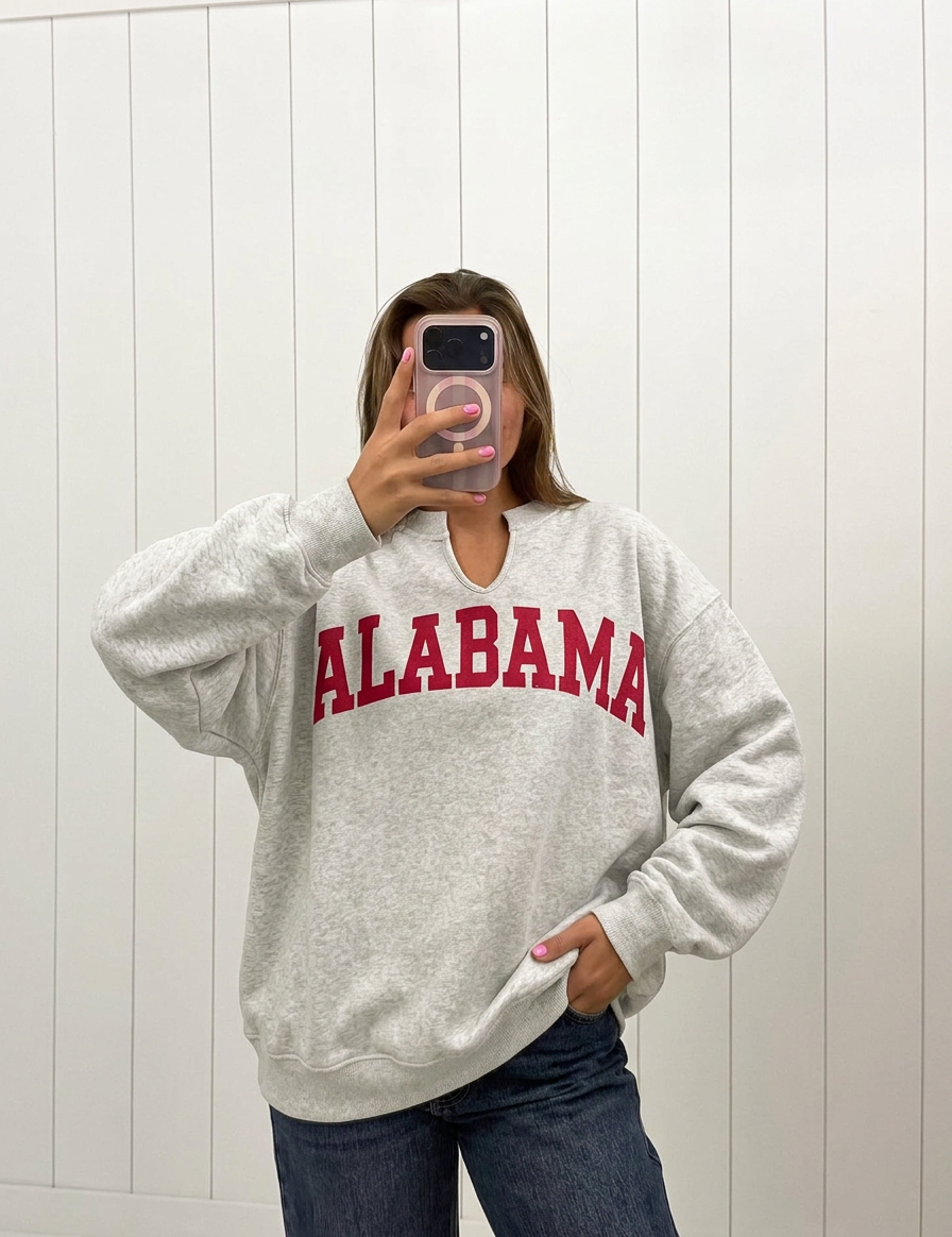 AI-assisted FASHN try-on of Alabama Reversible Oversized Pullover on boutique owner.
