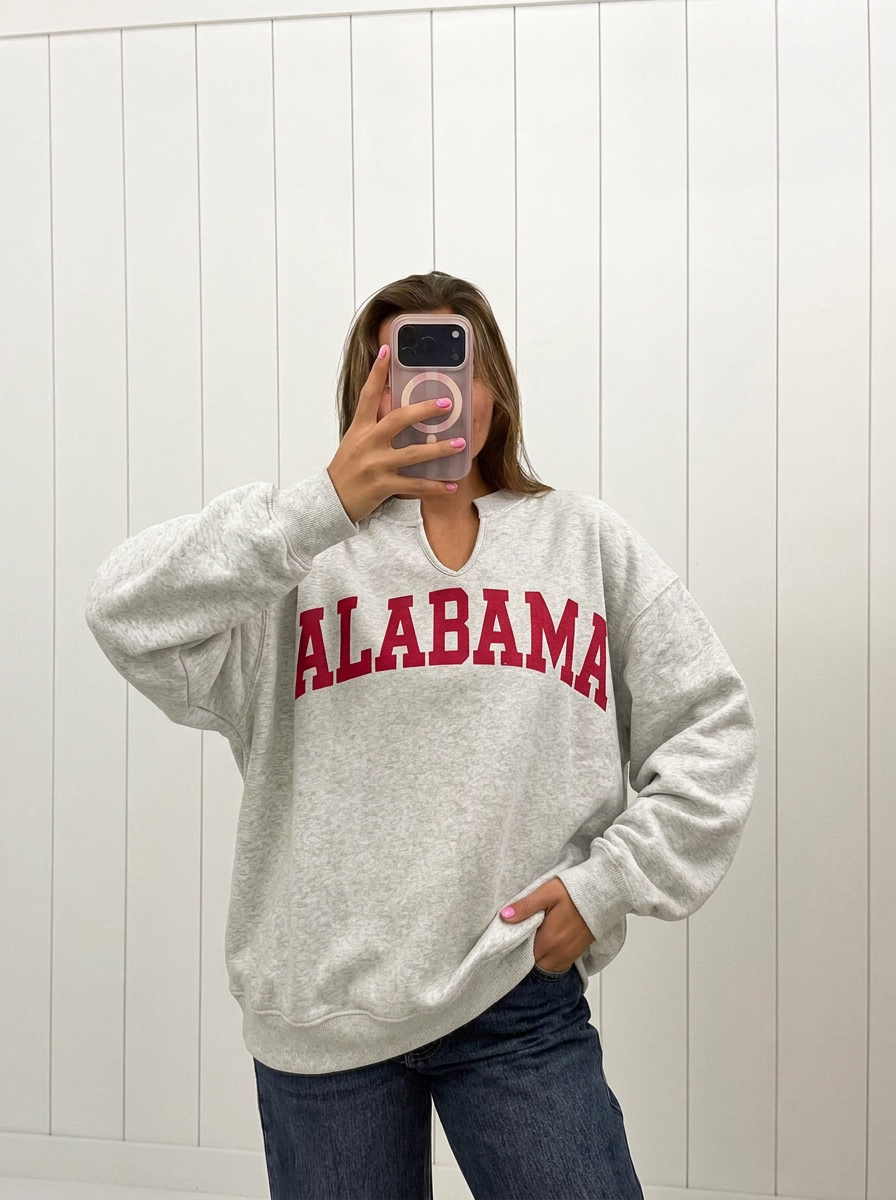 AI-assisted FASHN try-on of Alabama Reversible Oversized Pullover on boutique owner.