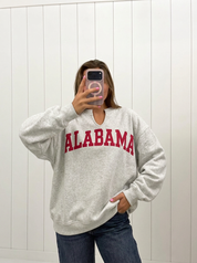 AI-assisted FASHN try-on of Alabama Reversible Oversized Pullover on boutique owner.