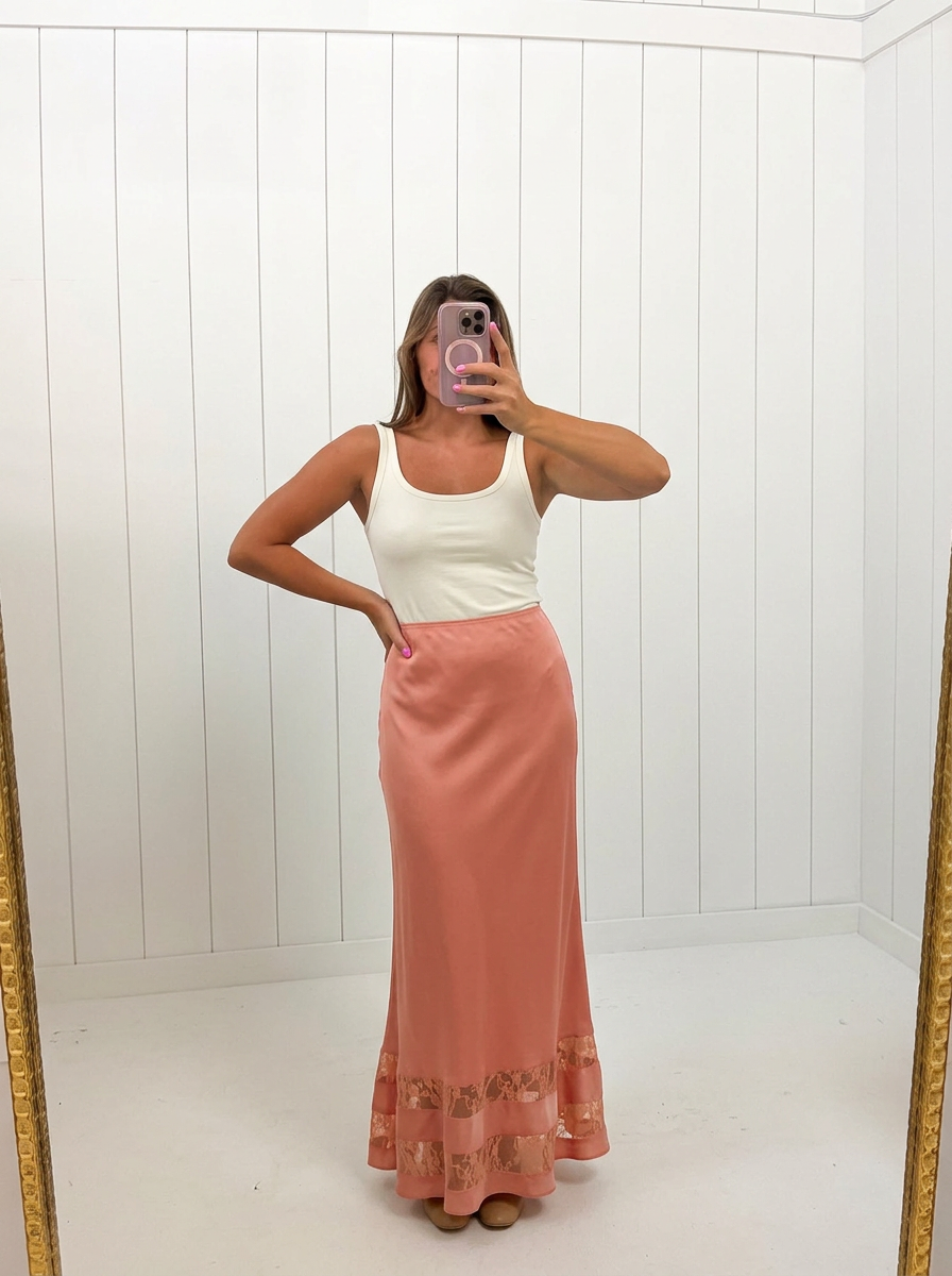 AI-assisted FASHN try-on of Coral Satin Lace Maxi Skirt on boutique owner.