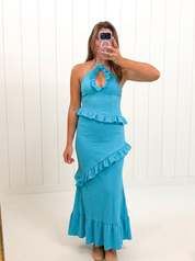 AI-assisted FASHN try-on of Blue Crinkle Maxi Dress on boutique owner.